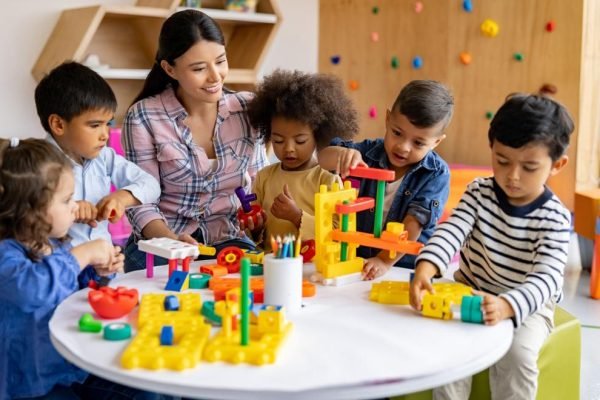 toyr-to-prepare-for-preschool-teacher-with-students-in-a-preschool-classroom_istock